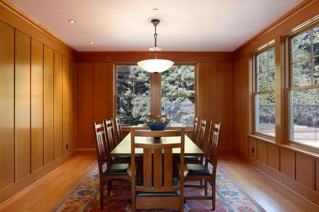 a view of a dining room with furniture window and outside view