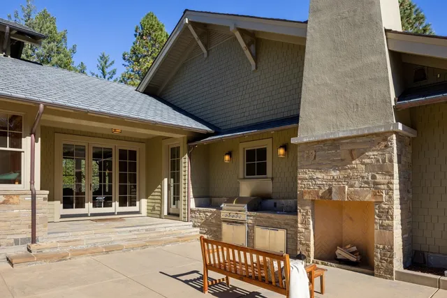 a swimming pool with outdoor seating and yard