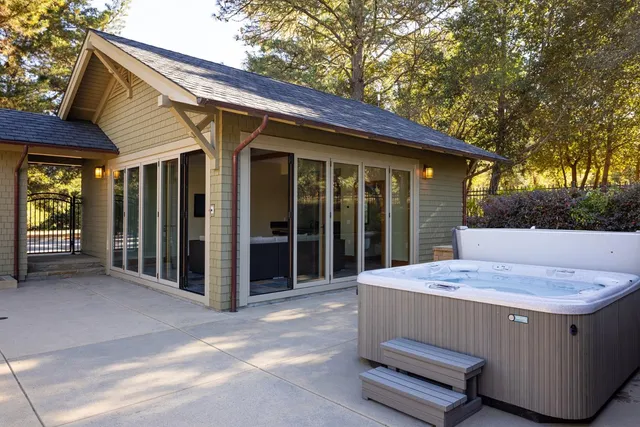 a living room with couches and a flat screen tv