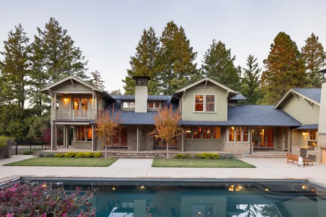a view of a room with lots of furniture and window