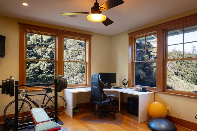 a bedroom with a large bed and a large window