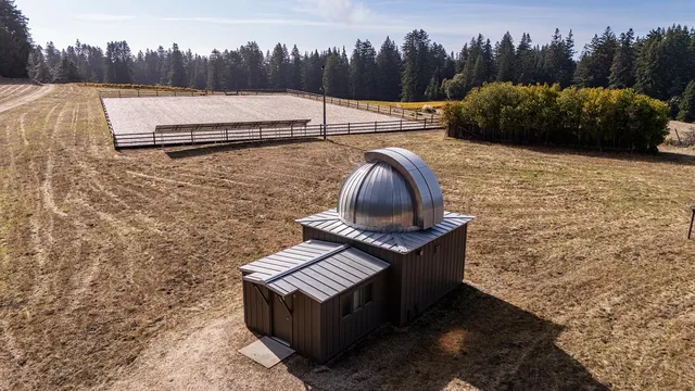a swimming pool with trees in the background