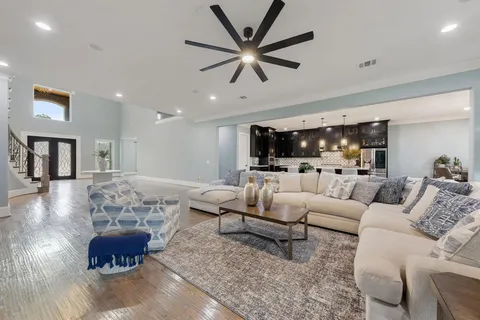 a view of an entryway with wooden floor