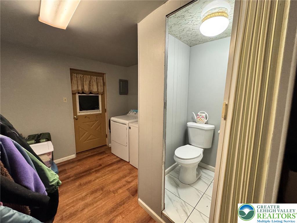 2336 3rd Street Wilson, PA 18042 - Photo 14 of 21 a bathroom with a toilet sink and mirror