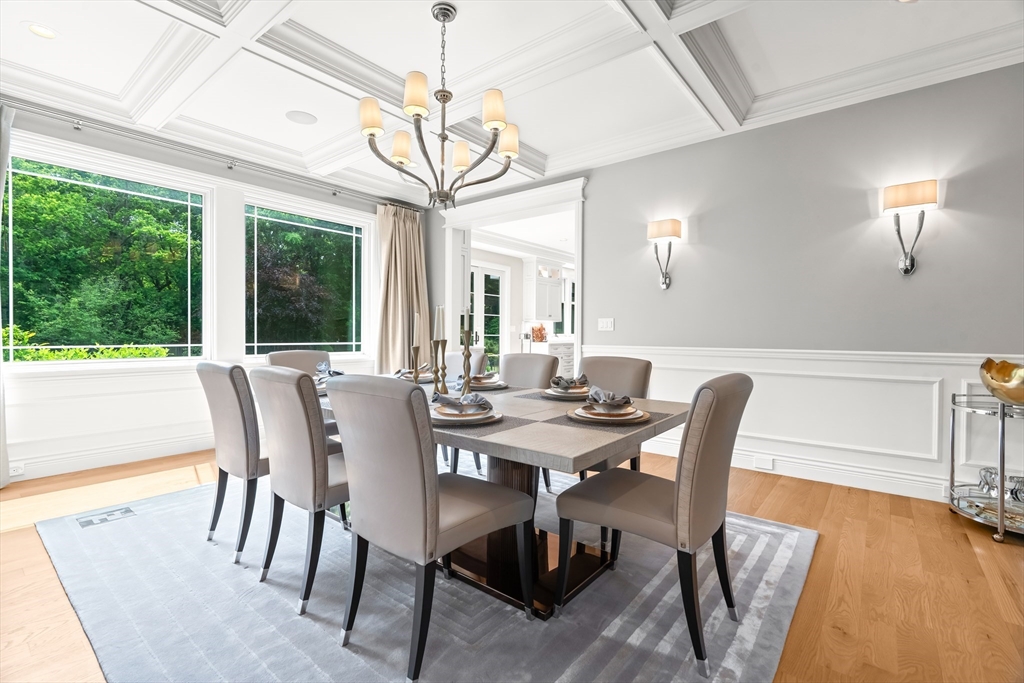 382 Lee Street Brookline, MA 02445 - Photo 15 of 38 a view of a dining room with furniture wooden floor and chandelier