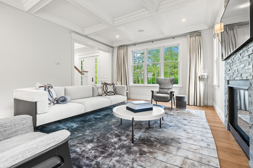 382 Lee Street Brookline, MA 02445 - Photo 17 of 38 a living room with furniture and a fireplace