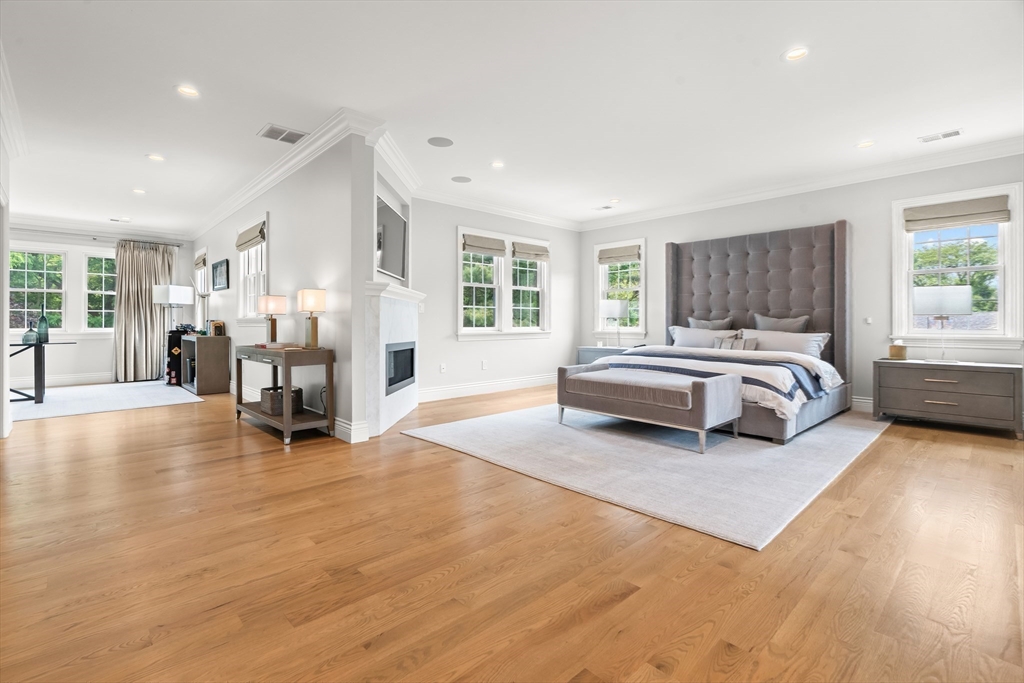 382 Lee Street Brookline, MA 02445 - Photo 23 of 38 a spacious bedroom with a bed and a large window