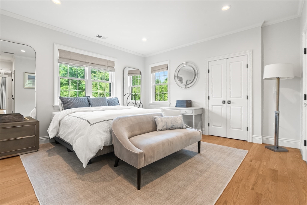 382 Lee Street Brookline, MA 02445 - Photo 32 of 38 a spacious bedroom with a bed and a large window