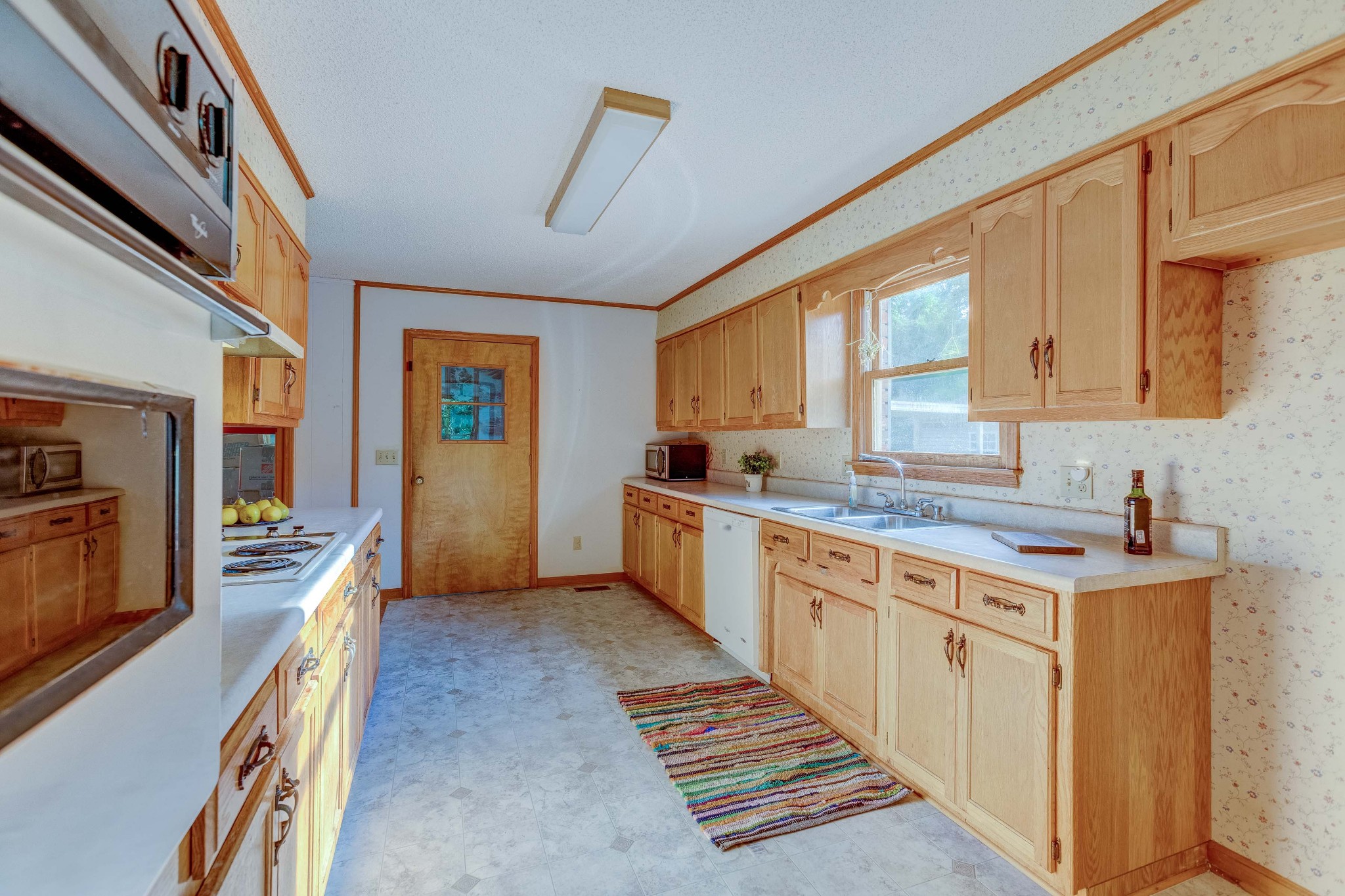 478 Brandon Road Manchester, TN 37355 - Photo 16 of 50 a kitchen with stainless steel appliances granite countertop a stove a sink and a refrigerator