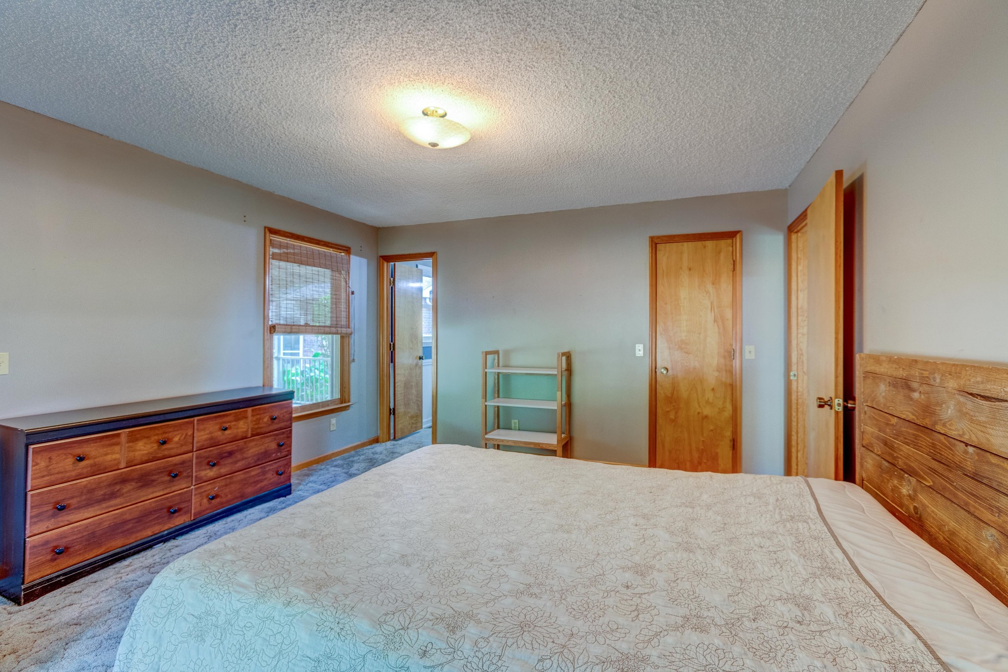 478 Brandon Road Manchester, TN 37355 - Photo 28 of 50 a bedroom with a bed and a dresser next to a window