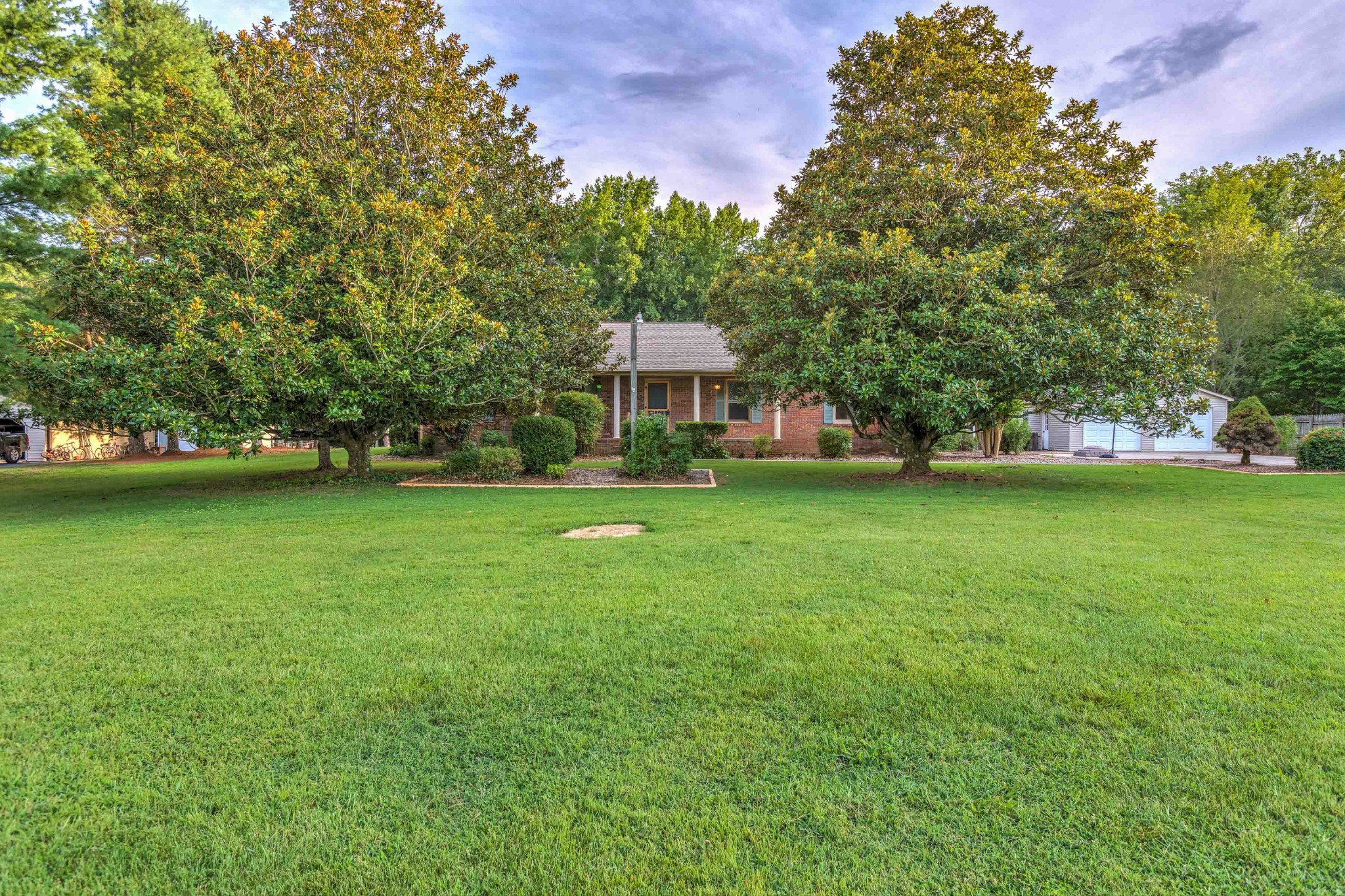 478 Brandon Road Manchester, TN 37355 - Photo 3 of 50 a front view of a house with a garden