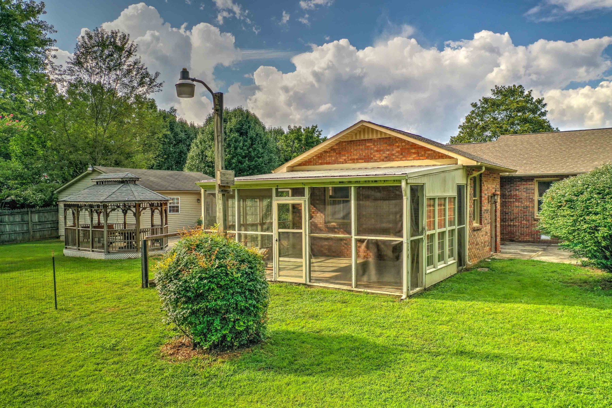 478 Brandon Road Manchester, TN 37355 - Photo 41 of 50 a view of a house with a backyard and a garden