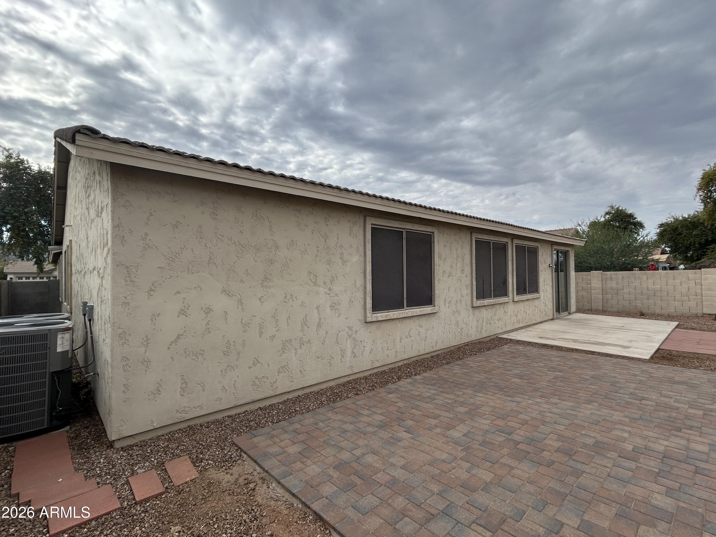 2202 West Carter Road Phoenix, AZ 85041 - Photo 18 of 20 a backyard of a house with table and chairs