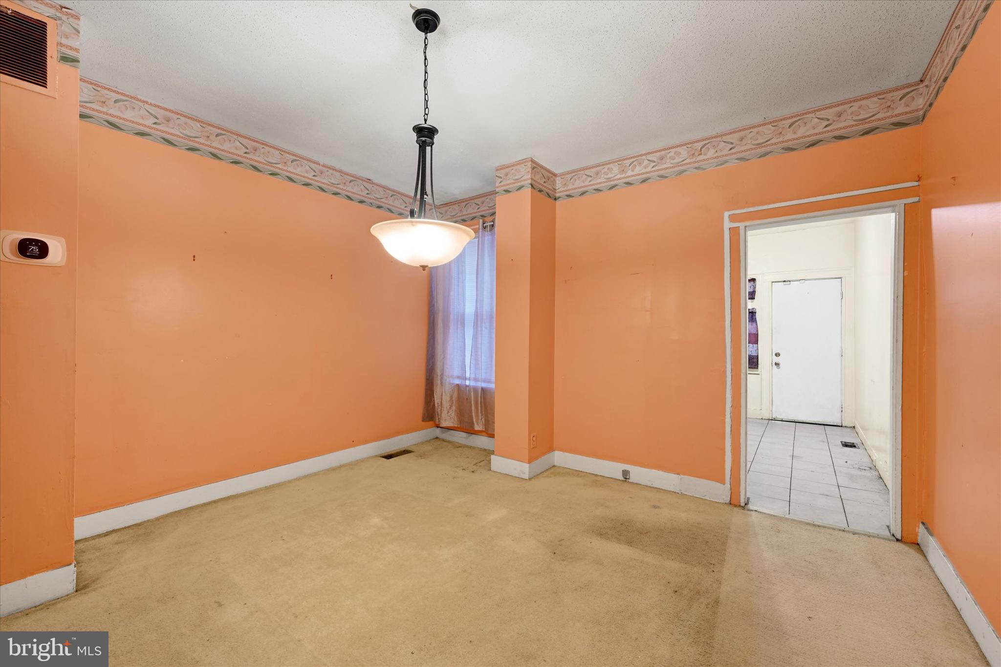 4024 Eierman Avenue Baltimore, MD 21206 - Photo 6 of 18 a view of an empty room with a chandelier