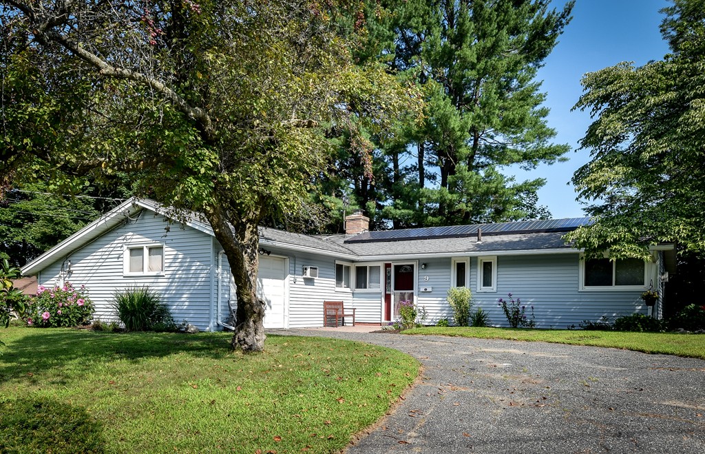 9 Ruth Drive Framingham, MA 01701 - Photo 1 of 25 a front view of a house with a garden