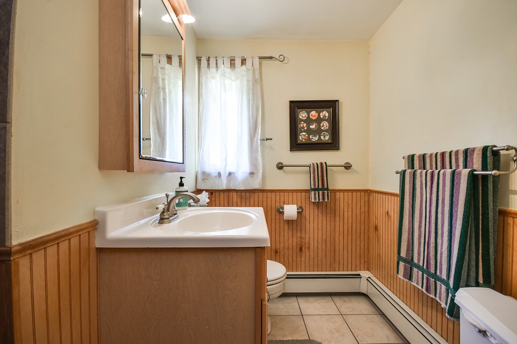 9 Ruth Drive Framingham, MA 01701 - Photo 16 of 25 a bathroom with a sink and a mirror