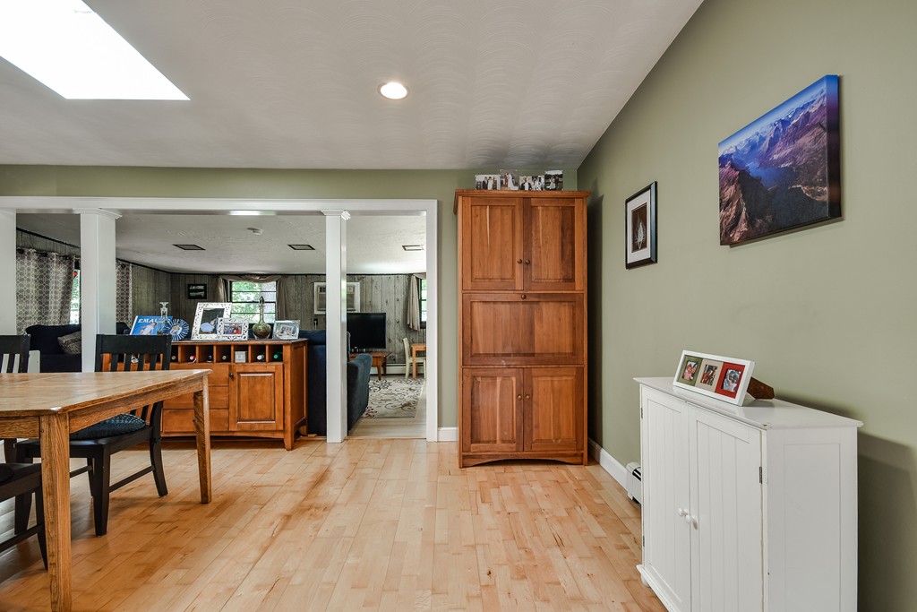 9 Ruth Drive Framingham, MA 01701 - Photo 8 of 25 a view of a kitchen with furniture and wooden floor