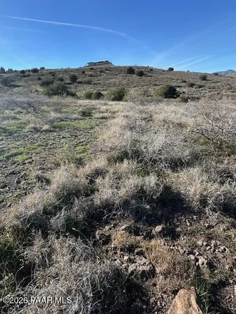 a view of a field with an outdoor space