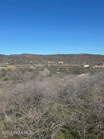 a view of ocean beach and mountain