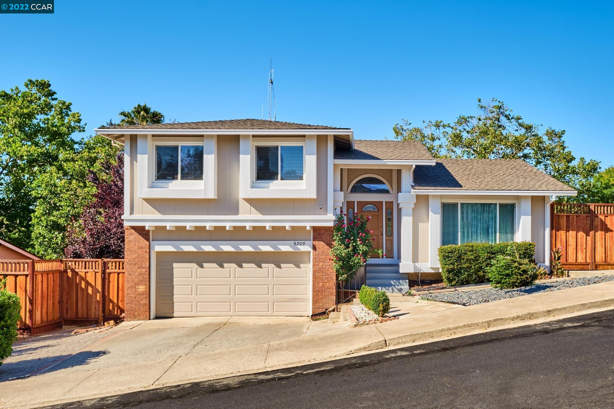 5205 Forrestgreen Court Concord, CA 94521 - Photo 1 of 1 a front view of a house with a garden