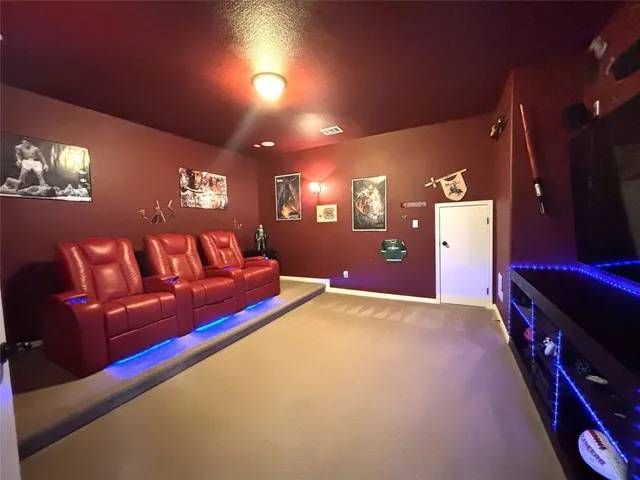 a view of a livingroom with furniture and a flat screen tv