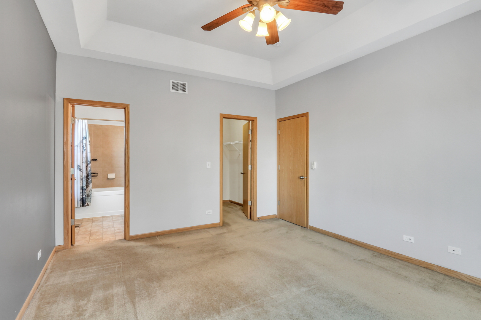1491 Sedgewood Court Round Lake, IL 60073 - Photo 14 of 31 an empty room with a chandelier fan and a bathroom