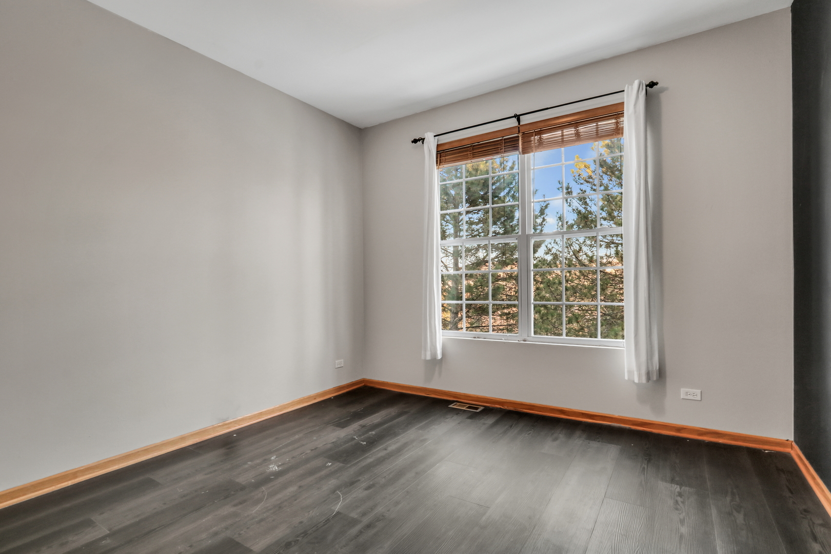 1491 Sedgewood Court Round Lake, IL 60073 - Photo 17 of 31 an empty room with wooden floor and windows