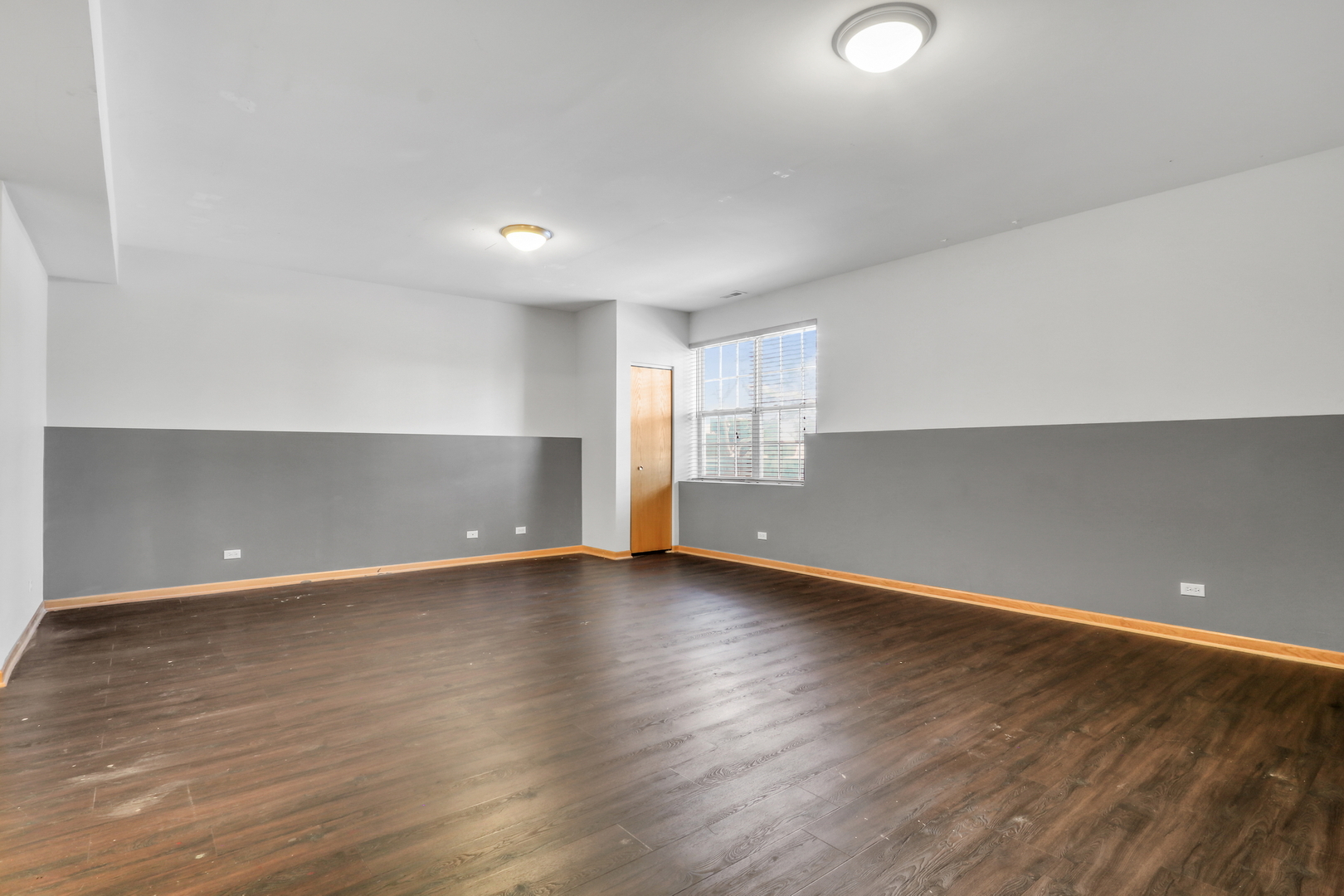 1491 Sedgewood Court Round Lake, IL 60073 - Photo 22 of 31 an empty room with wooden floor and windows
