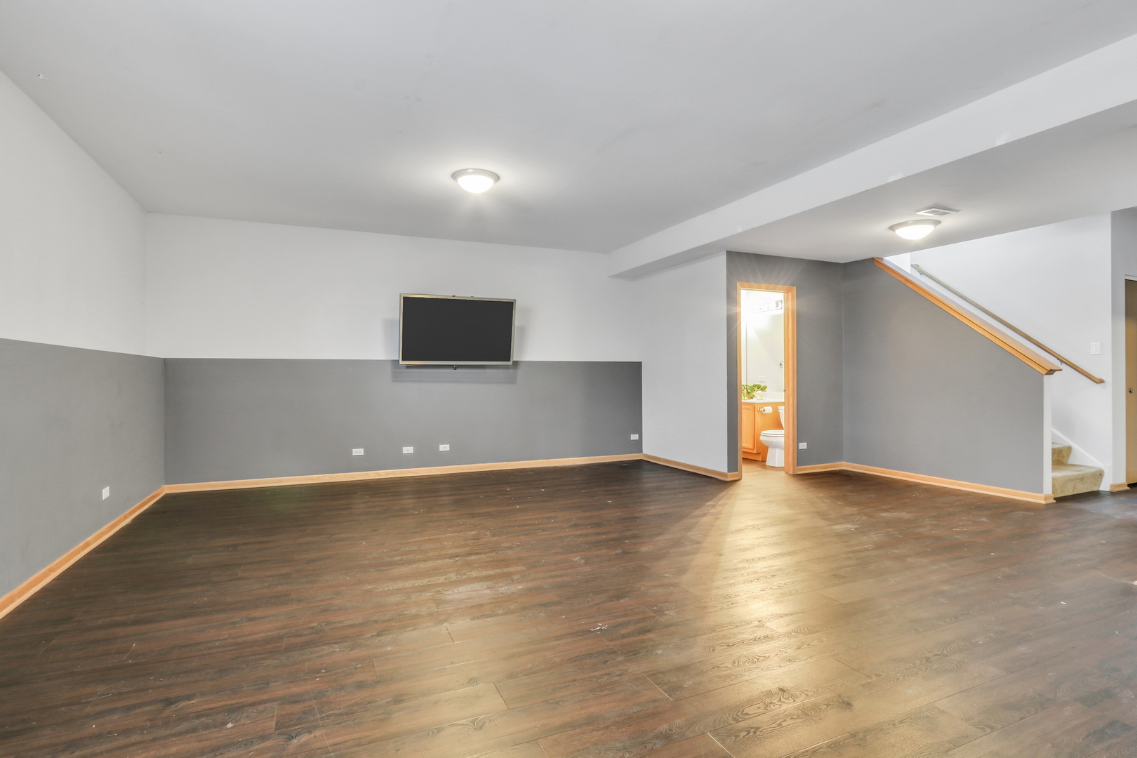 1491 Sedgewood Court Round Lake, IL 60073 - Photo 24 of 31 a view of an empty room with wooden floor and a window