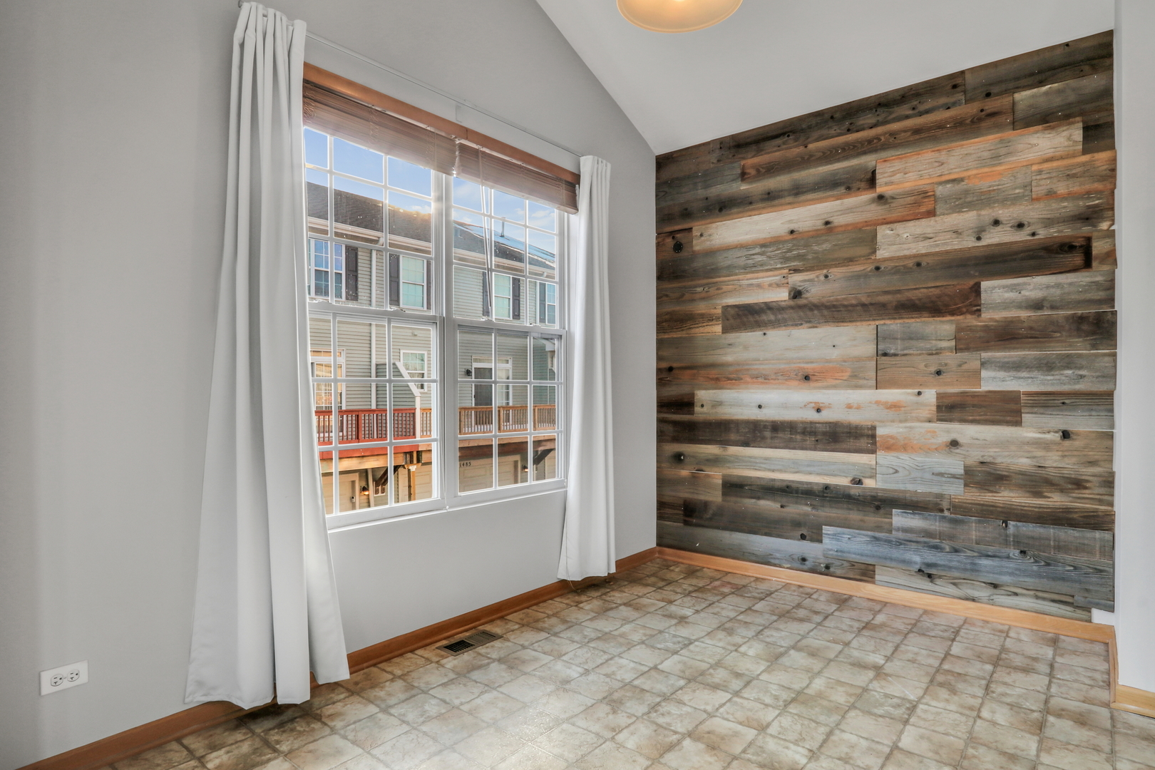 1491 Sedgewood Court Round Lake, IL 60073 - Photo 6 of 31 a view of an empty room with a window