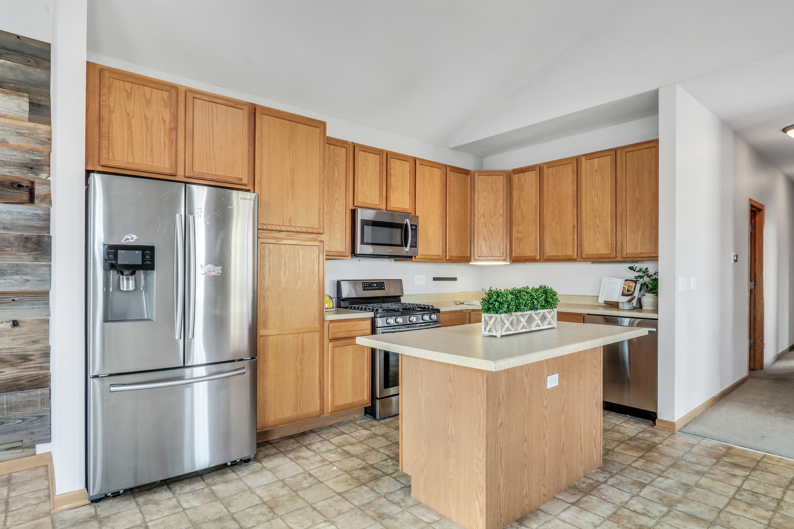 1491 Sedgewood Court Round Lake, IL 60073 - Photo 10 of 31 a kitchen with a refrigerator stove and microwave