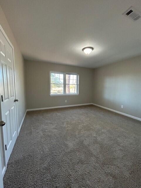 332 Cannon Drive Laurel Hill, FL 32567 - Photo 25 of 36 an empty room with a empty space and windows