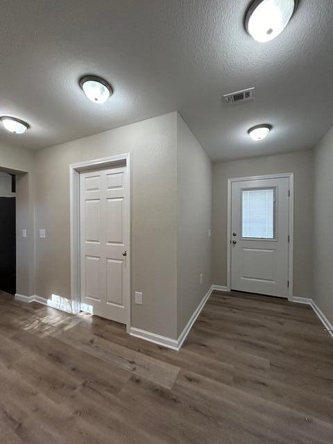 332 Cannon Drive Laurel Hill, FL 32567 - Photo 28 of 36 an empty room with wooden floor and windows