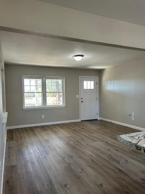 332 Cannon Drive Laurel Hill, FL 32567 - Photo 8 of 36 an empty room with wooden floor and windows