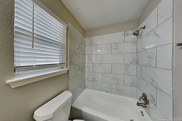 a bathroom with a sink and bathtub