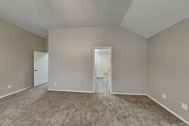 a view of an empty room and entryway