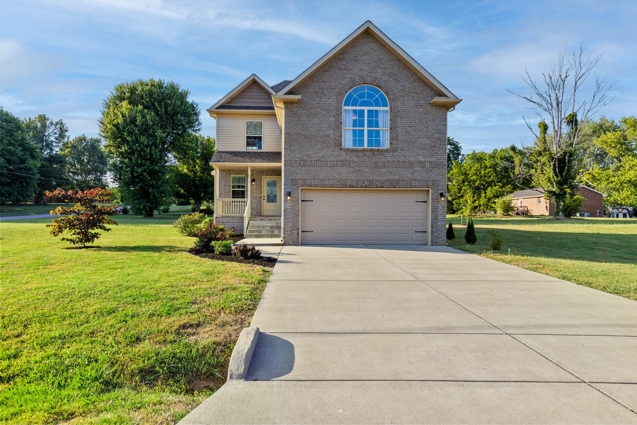 1646 Archer Drive Pleasant View, TN 37146 - Photo 1 of 33 a front view of a house with a yard
