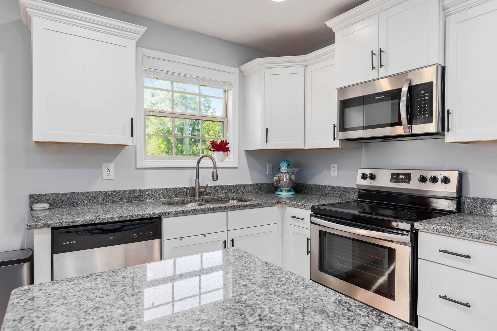 1646 Archer Drive Pleasant View, TN 37146 - Photo 12 of 33 a kitchen with stainless steel appliances granite countertop a stove a microwave a sink and a microwave
