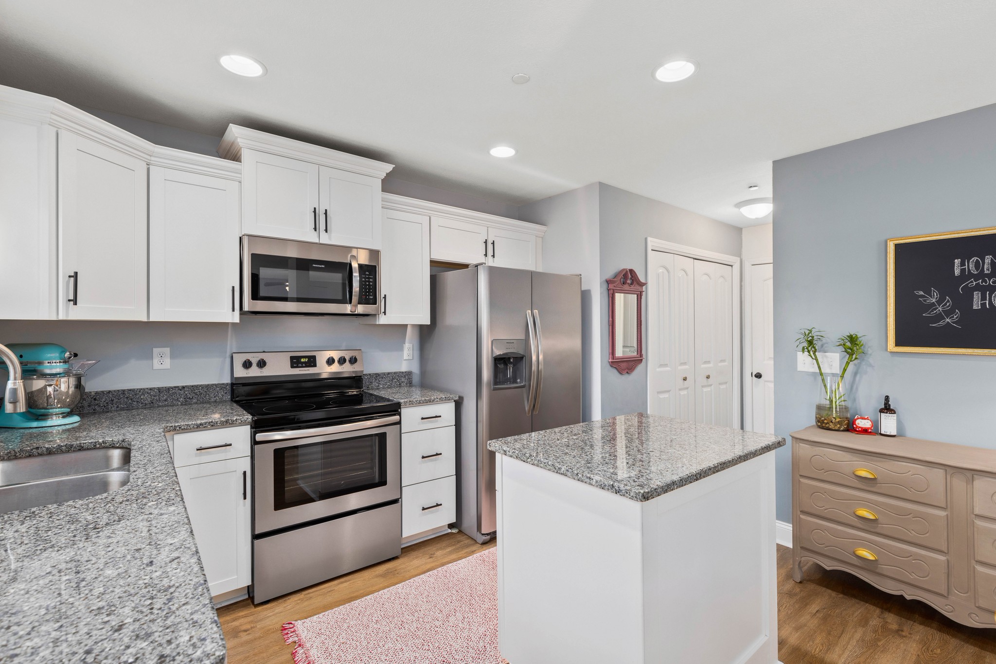 1646 Archer Drive Pleasant View, TN 37146 - Photo 13 of 33 a kitchen with stainless steel appliances granite countertop a stove a refrigerator and a microwave