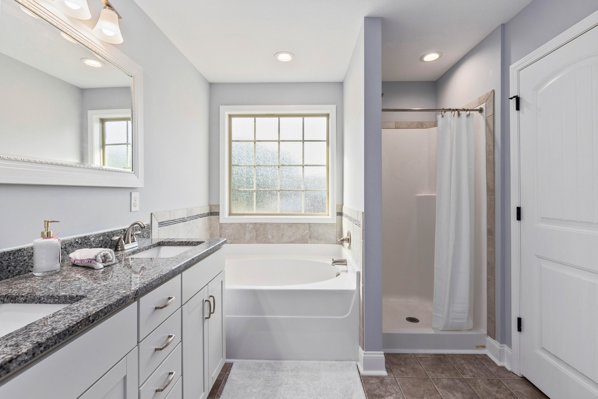 1646 Archer Drive Pleasant View, TN 37146 - Photo 17 of 33 a bathroom with a granite countertop tub sink and mirror