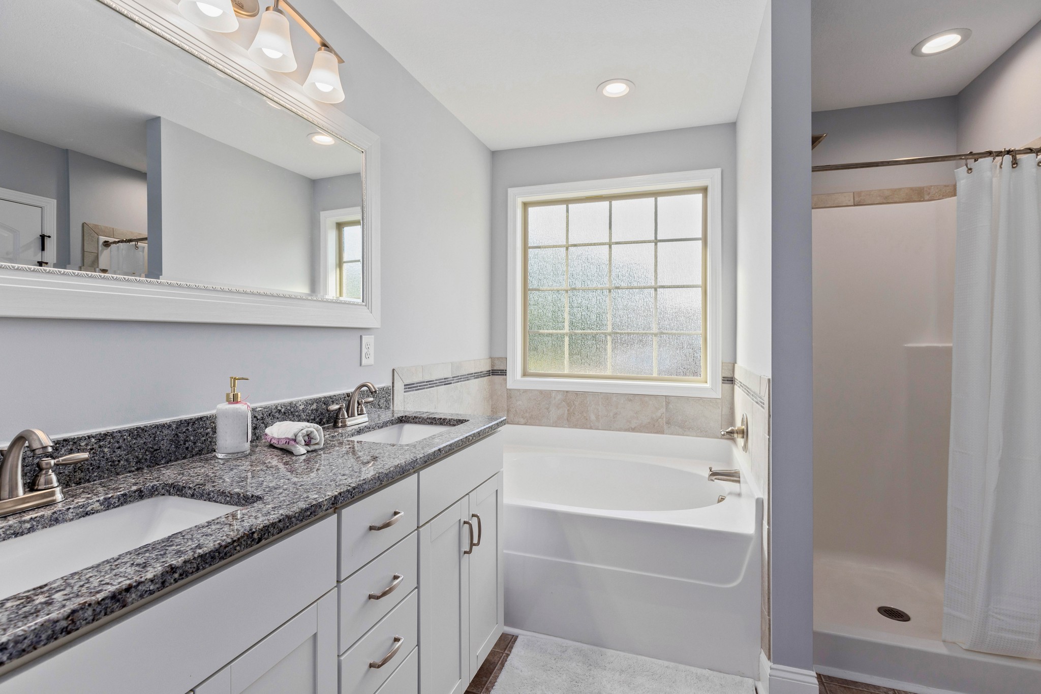 1646 Archer Drive Pleasant View, TN 37146 - Photo 18 of 33 a bathroom with a granite countertop sink mirror and bathtub