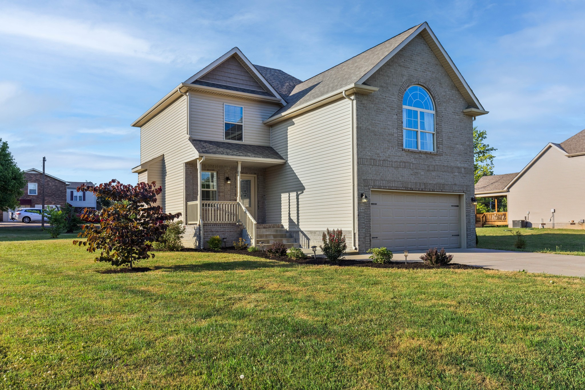1646 Archer Drive Pleasant View, TN 37146 - Photo 2 of 33 a front view of a house with a yard