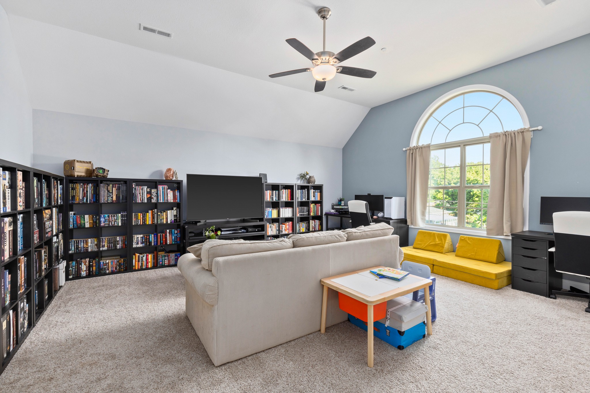 1646 Archer Drive Pleasant View, TN 37146 - Photo 26 of 33 a living room with furniture a chandelier and a flat screen tv