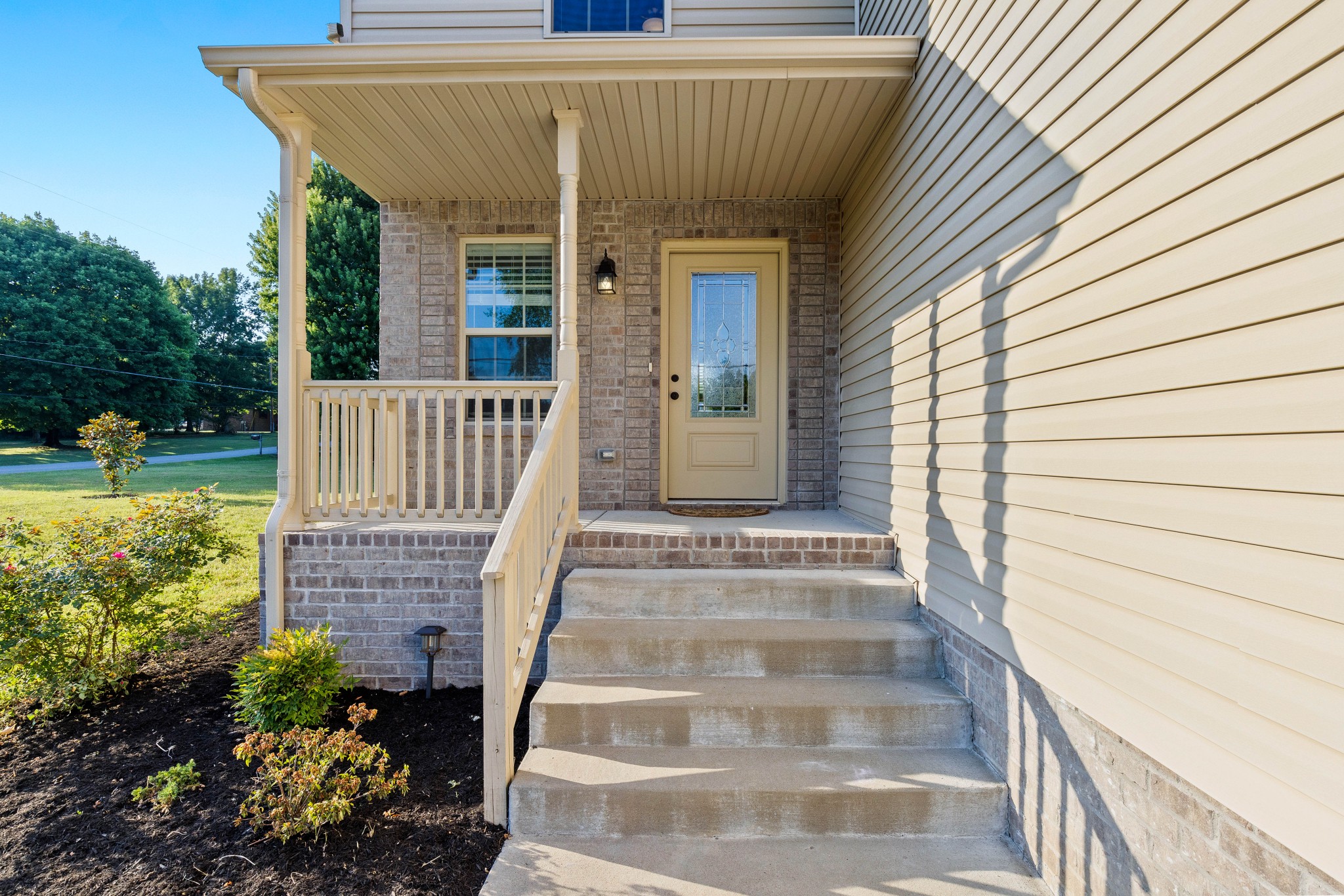 1646 Archer Drive Pleasant View, TN 37146 - Photo 3 of 33 a view of a brick house with a yard