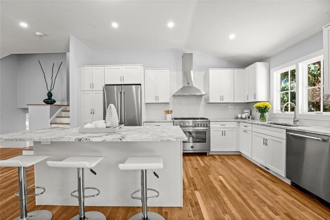 9 Country Ridge Drive Rye Brook, NY 10573 - Photo 1 of 1 a kitchen with stainless steel appliances granite countertop a stove refrigerator sink and cabinets