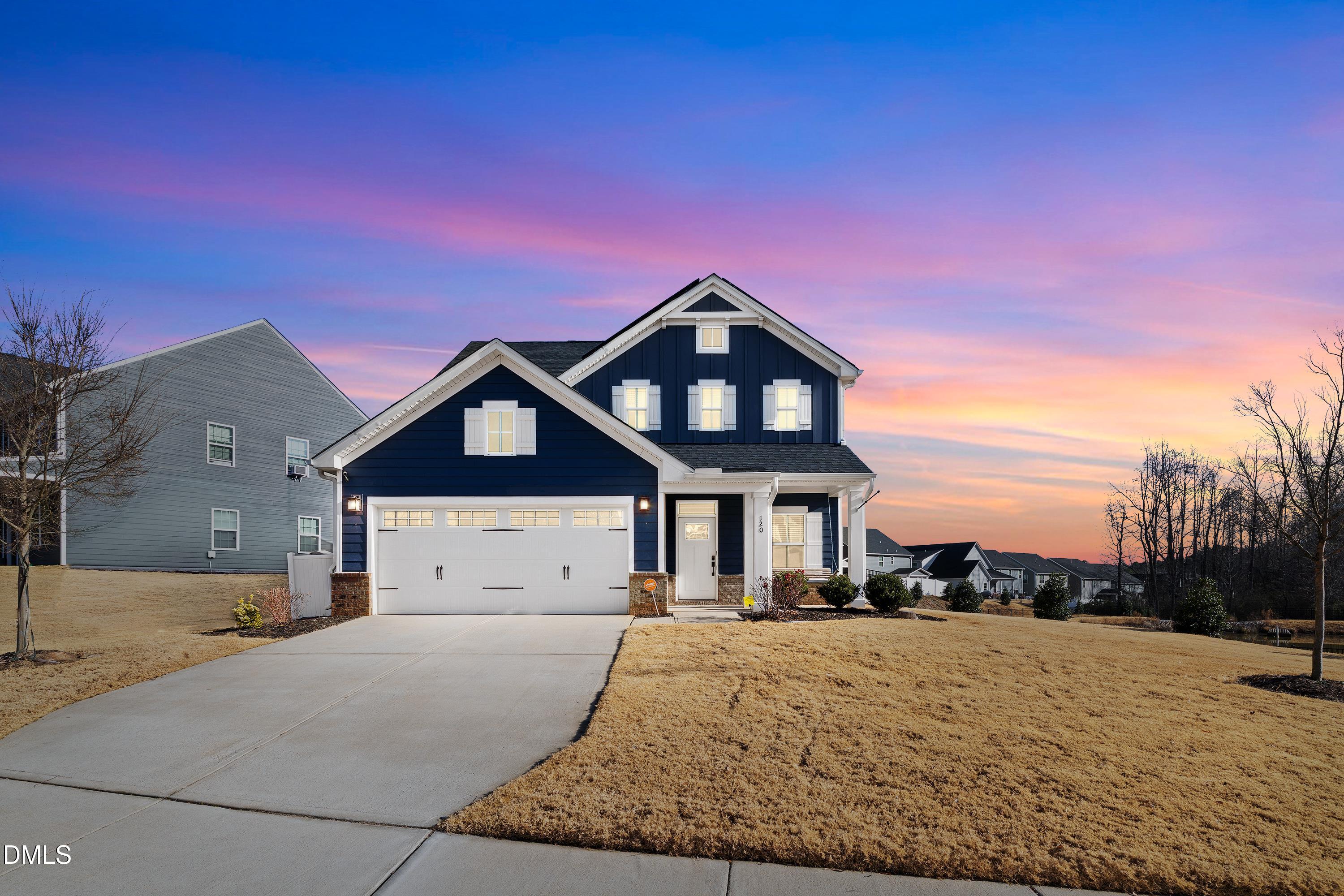 a front view of a house with a yard