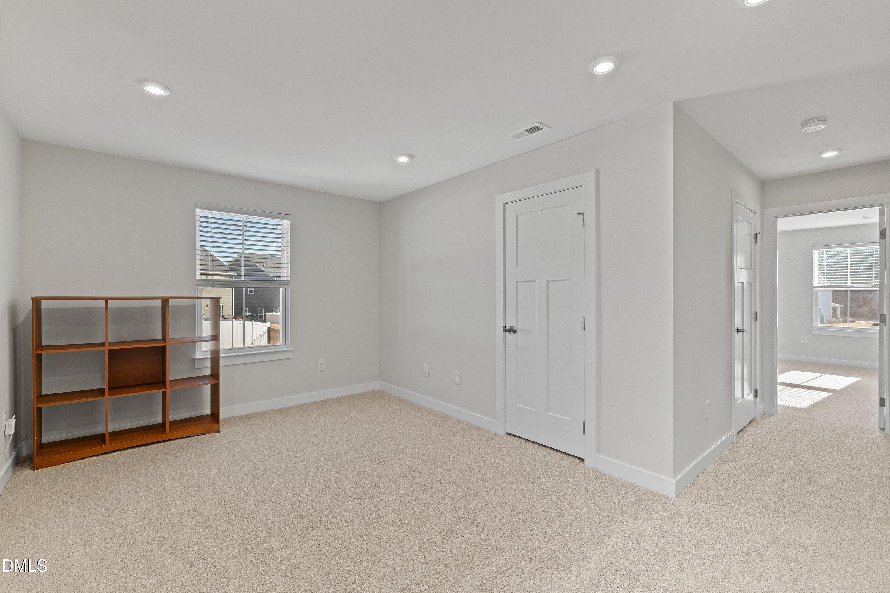 120 Misty Pike Drive Raleigh, NC 27603 - Photo 21 of 57 a view of an empty room with a window