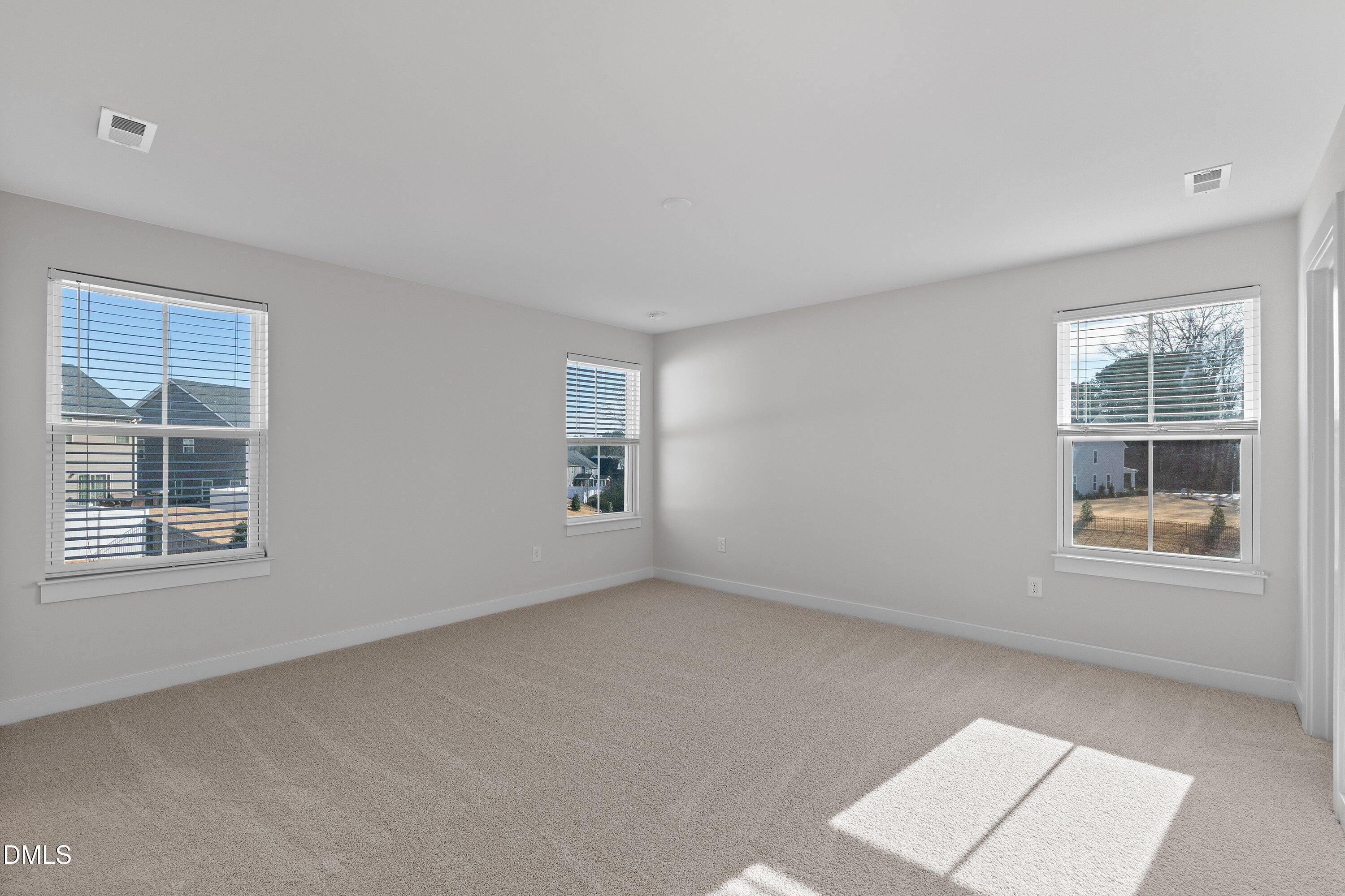 120 Misty Pike Drive Raleigh, NC 27603 - Photo 23 of 57 an empty room with windows