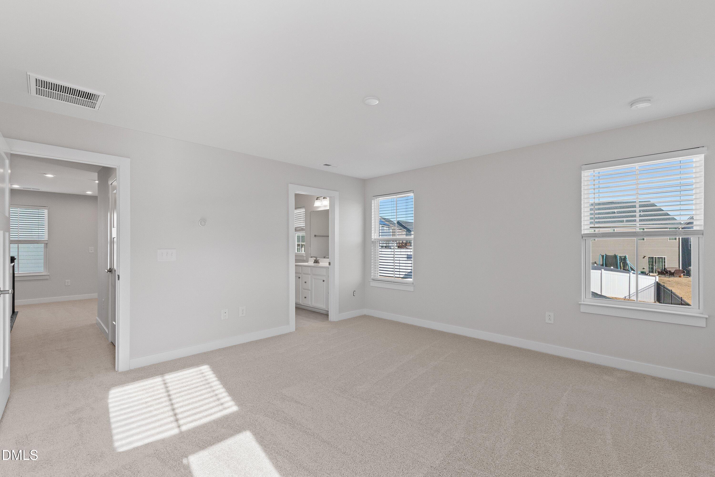 120 Misty Pike Drive Raleigh, NC 27603 - Photo 26 of 57 wooden floor in an empty room with a window