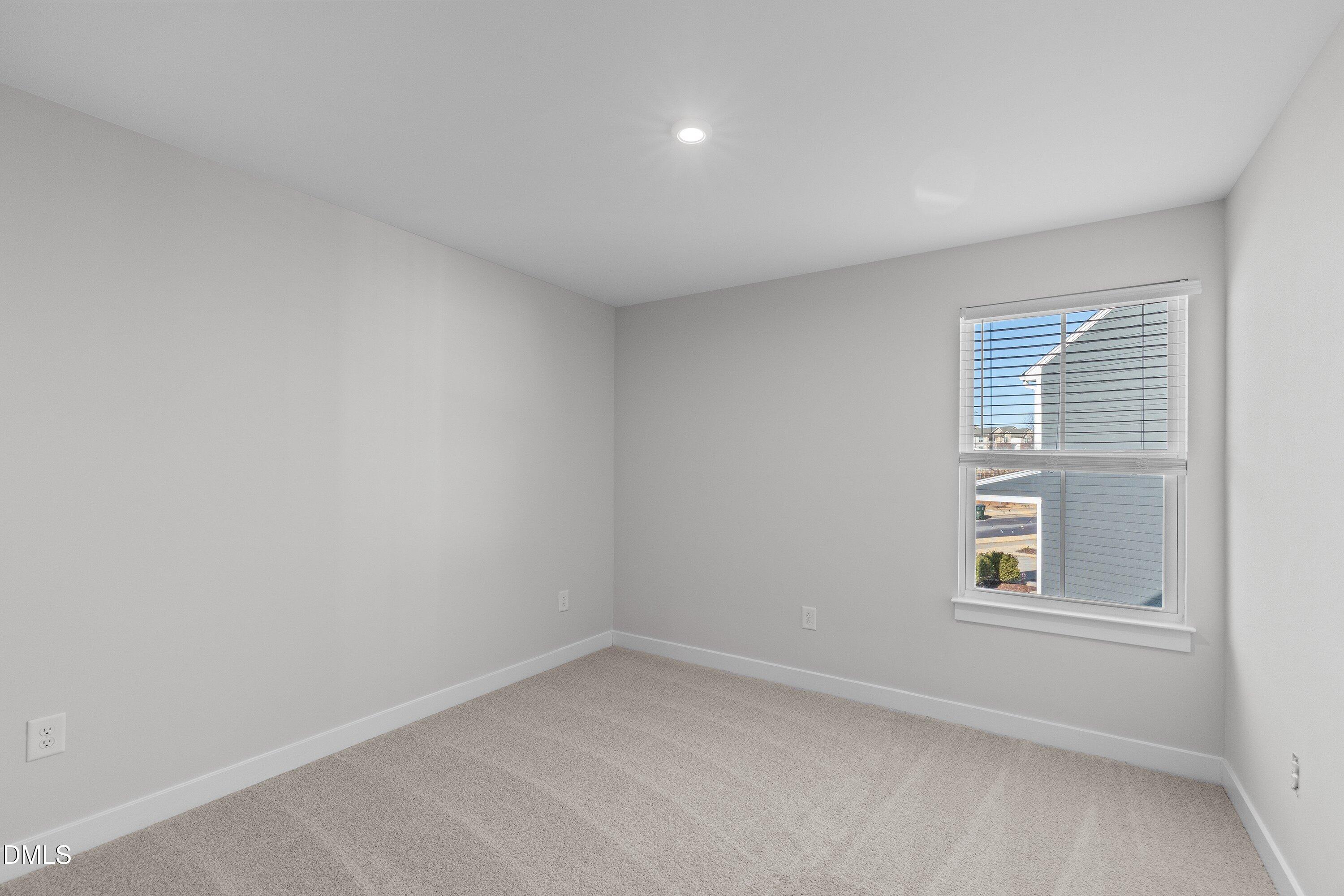 120 Misty Pike Drive Raleigh, NC 27603 - Photo 30 of 57 a view of an empty room with a window